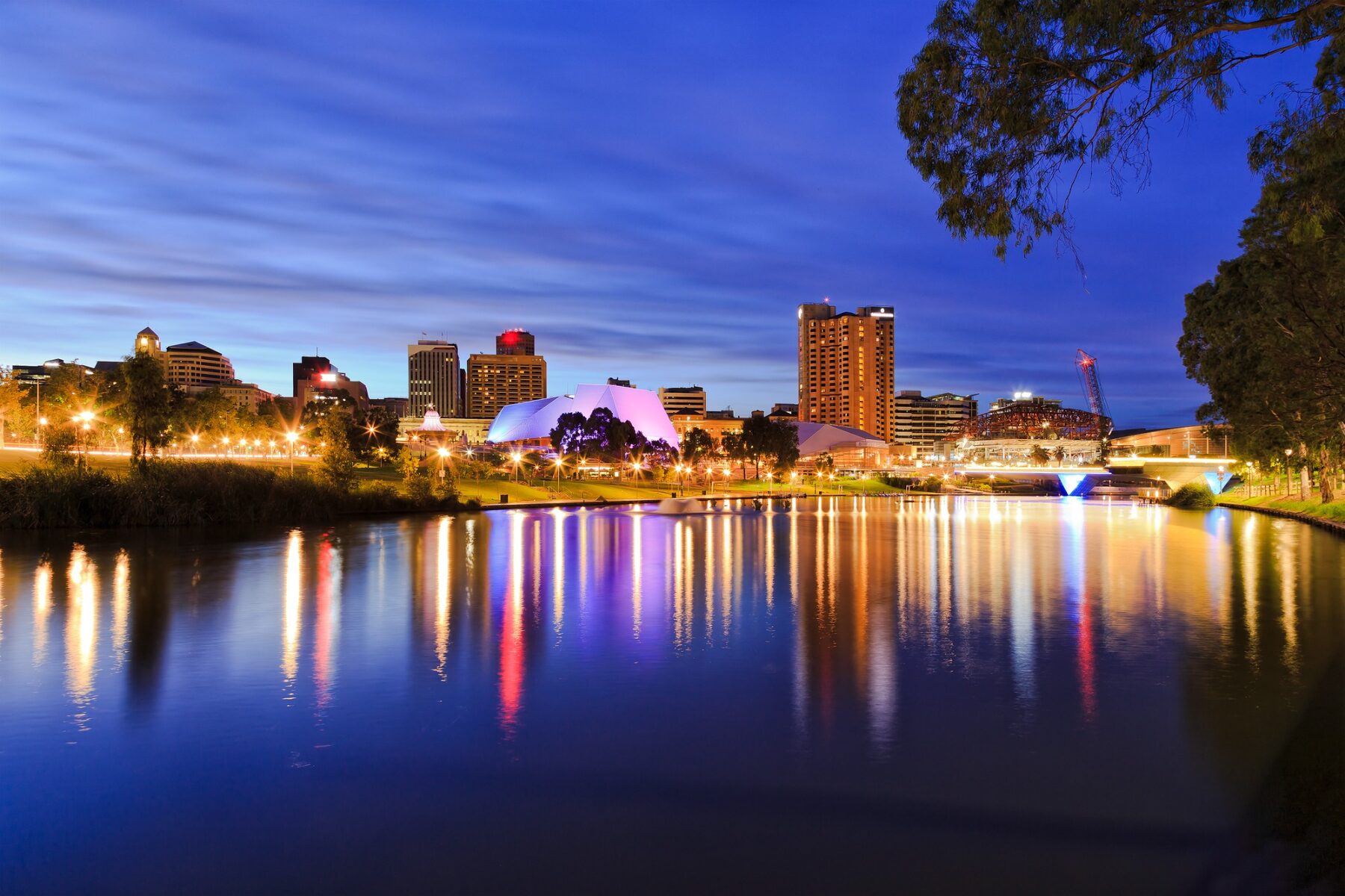 Adelaide city skyline viewed across the River Torrens at dusk